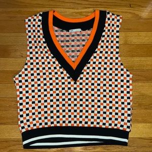 Black, white, and orange Zara sweater vest.